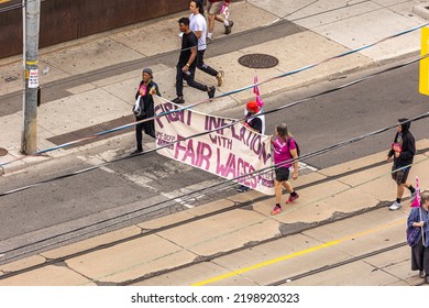 Toronto, Ontario - September 5, 2022 : Canadian Union Of Public Employees, Fight Inflation With Fair Wages Sign, Marching In The Labour Day Parade On Queen Street West