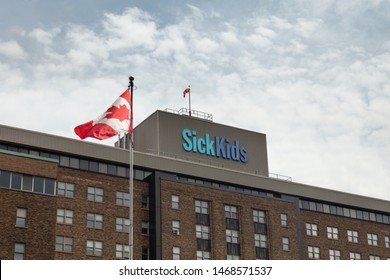 Toronto, Ontario/Canada - July 30 2019 Hospital For Sick Children Sick Kids University Avenue Building Sign Canadian Flag