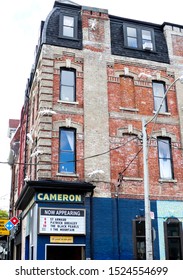 Toronto, Ontario/Canada - October 4 2019: Sign For Iconic Local Bar The Cameron House, A Small Bohemian Bar With Live Music In A Classic Brownstone Building From 1880 With Modern Silver Ant Sculptures