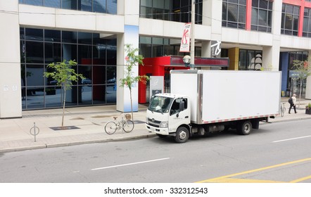 TORONTO, SEP. 29: White Delivery Van Truck Parked In Downtown Toronto, Canada Taken On Sept. 29, 2015.