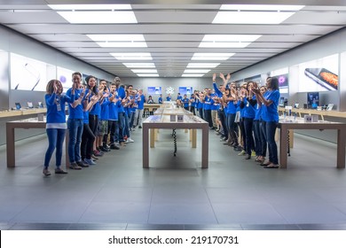TORONTO - SEPTEMBER 19: Apple staffs cheer at the Apple Store, Eaton Centre in Toronto, Canada on September 19, 2014. Apple's newest iPhones, the 6 and the 6 Plus go on sale this day.