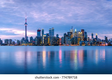 Toronto Skyline At Dusk And Reflection In Water