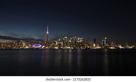 Toronto Skyline At Night - As Seen From Toronto Island. A Long Exposure Photo Of Toronto Cityscape.