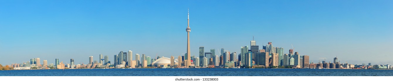 Toronto Skyline Panorama Over Lake With Urban Architecture.