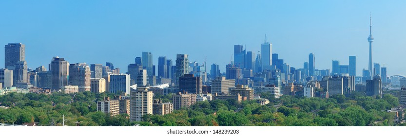 Toronto Skyline Panorama With Urban Architecture And Blue Sky