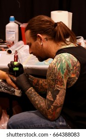 Toronto Tattoo Show: Northern Ink Xposure, June, 2017, Ontario, Canada. Tattoo Convention, Expo. Alternative Style, Rock Attire, Ink Art. Tattoo Master At Work. Work In Progress.