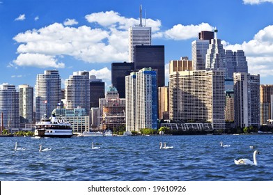 Toronto Waterfront With White Swans In The Harbour