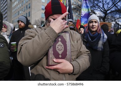 TORONTO-FEBRUARY 4:A Muslim man wiping his tears after hearing the names of the victims of the Quebec mosque attack during a rally in front of the US Consulate on February  4, 2017 in Toronto, Canada.