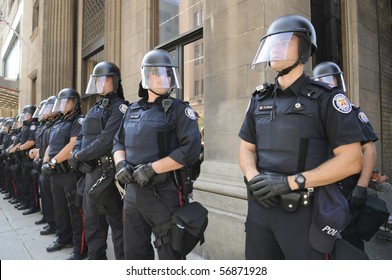 TORONTO-JUNE 25:  Toronto Police Officers In Riot Gear Line Up  During The G20 Protest On June 25, 2010 In Toronto, Canada.