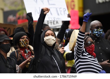 TORONTO-MAY 30:People Chanting Slogans And Showing  BLM Fist During A Rally To Protest The Death Of A Black Woman With Mental Illness, Died In Police Presence On May 30,2020 In Toronto,Canada