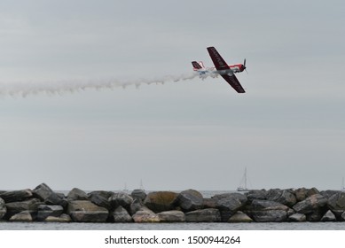 Toronto/ON, Canada – September 1, 2019: YAK 50 in an air at the 70th annual Canadian International Air Show (CIAS) over Lake Ontario