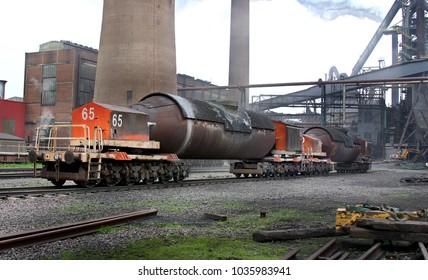 Torpedo rail cars at blast furnace plant used to transfer hot liquid iron to the steelmaking plant.
