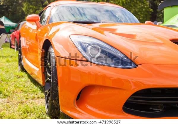 TORPOINT CORNWALL ENGLAND - 7 AUGUST, 2016- Detail\
of hot orange Dodge Viper SRT10 supercar taken at the American and\
Custom Car Show at Mount Edgcumbe House in Cornwall UK. Editorial\
Use Only