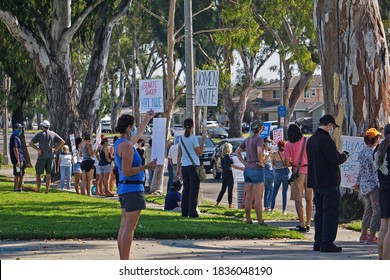 Torrance, California USA-Oct. 17, 2020: Activists Gather At Civic Center Park To Express Strong Opposition To President Trump And His Agenda, One Of Numerous Unified Women’s March Protests Nationwide.