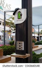 Torremolinos, Spain - October 19, 2019: Public Point Mobile Phone Charging Station In The Plaza De Andalucia Square