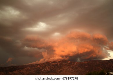  Torrential rain during monsoon season thunder storm with huge gray and orange clouds over the catalina mountains in Tucson Arizona amazing - Shutterstock ID 679197178
