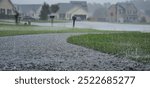 Torrential rains pour down in a residential neighborhood during hurricane in North Carolina. 
