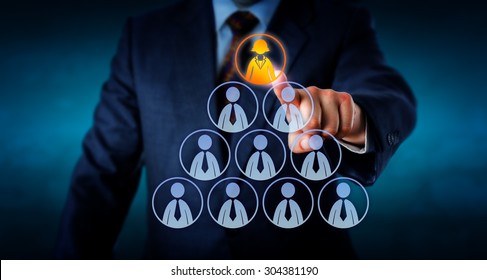 Torso Of A Human Resources Manager Is Selecting A Female Office Worker Atop A Pyramid Made Out Of Otherwise Male Employee Icons. Business Metaphor For Leadership, Headhunting And Career Success.