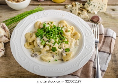 Tortellini with blue cheese sauce, little chive and parsley on top, nice and delicious food - Powered by Shutterstock