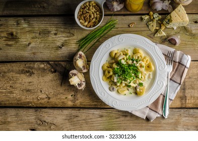 Tortellini with blue cheese sauce, little chive and parsley on top, nice and delicious food - Powered by Shutterstock