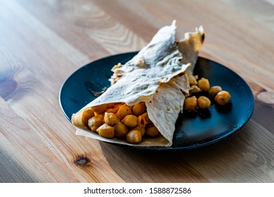 Tortilla Chickpea Wrap Samosa Buritto Ready To Eat With Natural Daylight On Wooden Table. Traditional Food.