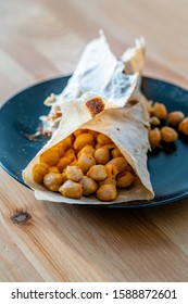 Tortilla Chickpea Wrap Samosa Buritto Ready To Eat With Natural Daylight On Wooden Table. Traditional Food.