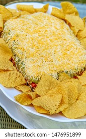 Tortilla Chips With 7 Layer Bean Dip For Outdoor Picnic Party Appetizer