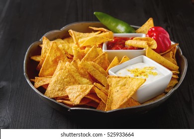 Tortilla Chips On A Blue Plate With Spicy Tomato Salsa. Mexican Food. Dark Background.