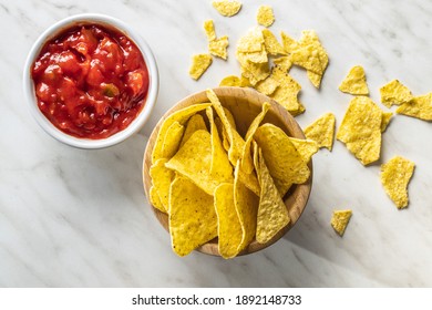Tortilla Chips And Red Tomato Salsa Dip. Mexican Nacho Chips On Kitchen Table.