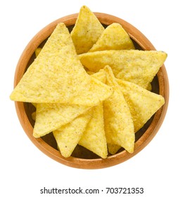 Tortilla Chips In Wooden Bowl. Snack Food Made From Corn Tortillas Or Corn Masa, Cut Into Triangle Shaped Wedges, Fried In Oil And Salted. Isolated Macro Food Photo Close Up From Above Over White.