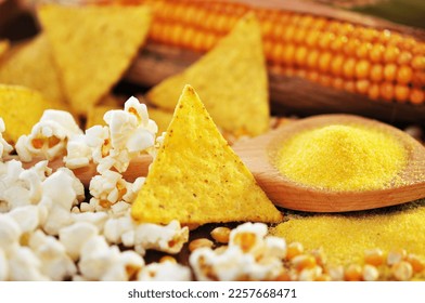Tortilla, corn with popcorn and corn leaf on wooden background, closeup. - Shutterstock ID 2257668471