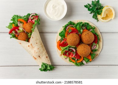 Tortillas, Wrapped Falafel Balls, With Fresh Vegetables, Vegetarian Healthy Food, On A Wooden White Background, No People, Selective Focus.