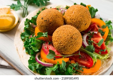 Tortillas, Wrapped Falafel Balls, With Fresh Vegetables, Vegetarian Healthy Food, On A Wooden White Background, No People, Selective Focus.