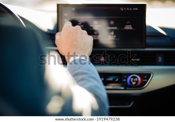 Tortosa,Tarragona; 02.17.2021: A hand touching
the car touch
screen.