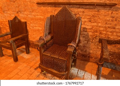 A torture device - the Iron Chair. The victim was seated on several strips or plates of brass and placed over an open flame and slowly roasted alive.