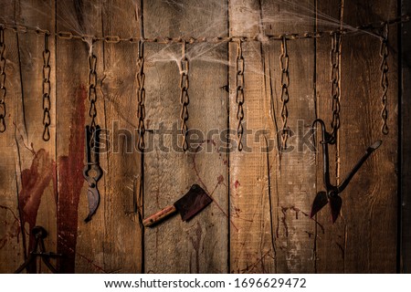 Torture tools on wood background