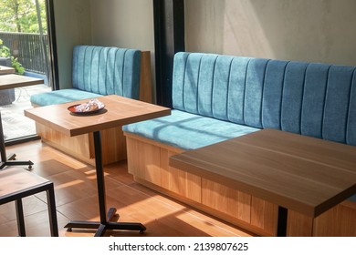 Tosca blue sofa in the corner of the cafe. industrial furniture design. - Shutterstock ID 2139807625