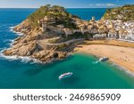Tossa de Mar town on Costa Brava Mediterranean coast in Catalonia, Spain. Beautiful beach with turquoise color water and Tossa de Mar fortress during summer in Catalonia.