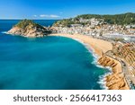 Tossa de Mar town on Costa Brava Mediterranean coast in Catalonia, Spain. Beautiful beach with turquoise color water and Tossa de Mar fortress during summer in Catalonia.