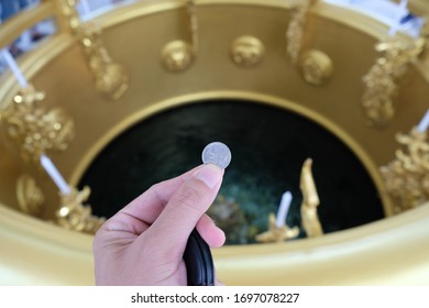 Tossing Coin Into Wishing Well