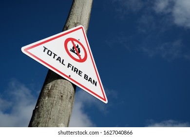 Total  Fire Ban Sign On A Wooden Pole