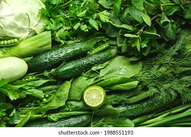 Total Green. Vegetables and dark food background as a healthy eating. Concept of fresh garden produce organically grown. Symbol of health as cabbage, mint, cucumber, onion, spinach and other - Powered by Shutterstock