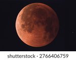 Total lunar eclipse captured on September 8, 2025, Wuhan, China, showing red blood moon against dark night sky, a spectacular astronomical phenomenon in the solar system