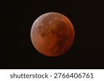 Total lunar eclipse captured on September 8, 2025, Wuhan, China, showing red blood moon against dark night sky, a spectacular astronomical phenomenon in the solar system