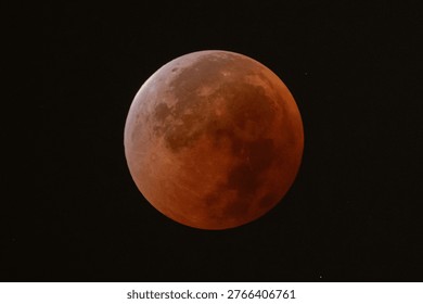 Total lunar eclipse captured on September 8, 2025, Wuhan, China, showing red blood moon against dark night sky, a spectacular astronomical phenomenon in the solar system