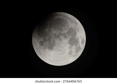 Total lunar eclipse captured on September 8, 2025, Wuhan, China, showing red blood moon against dark night sky, a spectacular astronomical phenomenon in the solar system