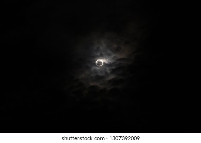 Total lunar eclipse in the cloudy sky