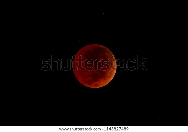 Total\
Lunar Eclipse of July 2018. The Maximum contact from Earth\'s Umbra\
at 04:22hrs, 28/07/2018 (UTC +8) with stars visible during the full\
eclipse. Shot from Papar, Sabah, Malaysian\
Borneo.