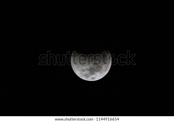 Total Lunar Eclipse of July 2018. The contact from\
Earth\'s penumbra at 02:48hrs, 28/07/2018 (UTC +8) with stars\
visible during the longest full eclipse of this century.  Imaged\
from Papar, MY