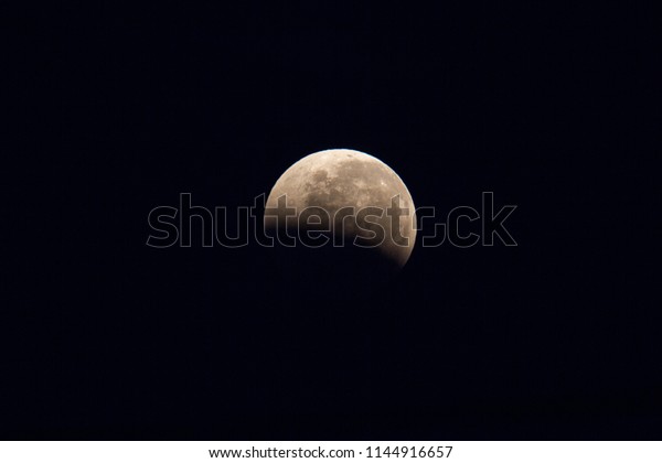 Total Lunar Eclipse of July 2018.\
The final phase of the Lunar Eclipse at 05:56hrs visible during the\
longest full eclipse of this century.  Imaged from Papar,\
MY